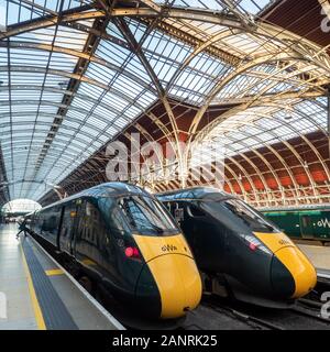 Boarding a train at Paddington railway station in London Stock Photo