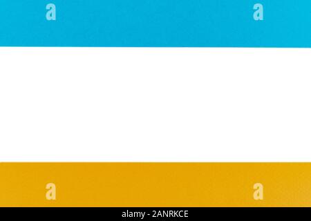 Blue and yellow paper with rolled edge with blank space. Paper with white copy space. Empty space for your message. Two pieces of paper with opening s Stock Photo