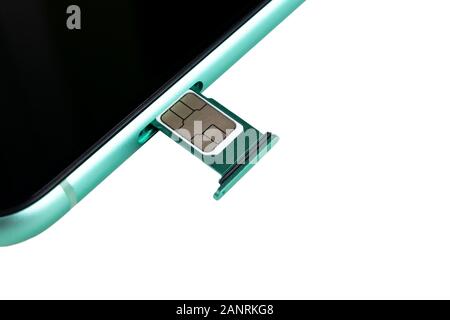 Modern mobile phone and sim card isolated on a white background. Smartphone with nano Sim Card and Card Adapter isolated over white Stock Photo