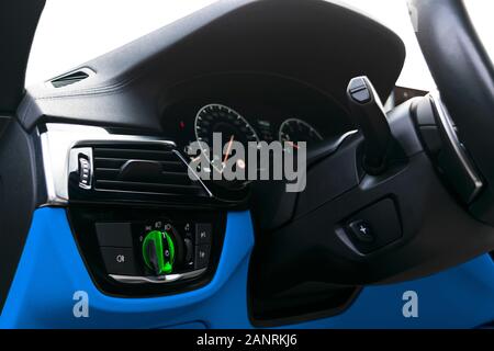 Car interior with light switch. The light knob in the car. Multifunction headlight console control switch. Turn on-off headlight switch in the car. Stock Photo