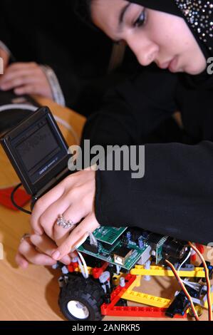 Qatar Foundation University. Qatari woman Student building a robot for the botball competition. Stock Photo