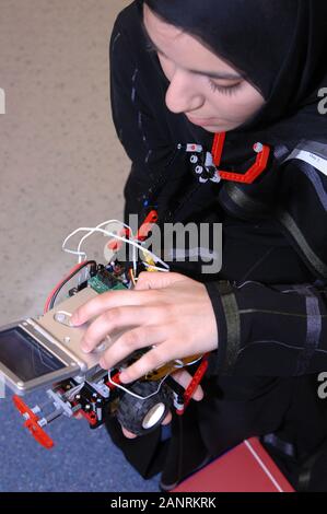 Qatar Foundation University. Qatari woman Student building a robot for the botball competition. Stock Photo