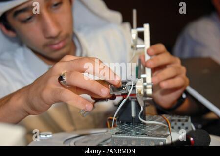 Qatar Foundation University. Qatari Student building a robot for the botball competition. Stock Photo