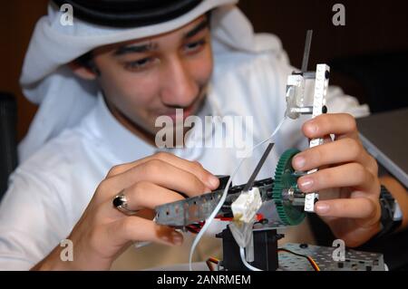 Qatar Foundation University. Qatari Student building a robot for the botball competition. Stock Photo