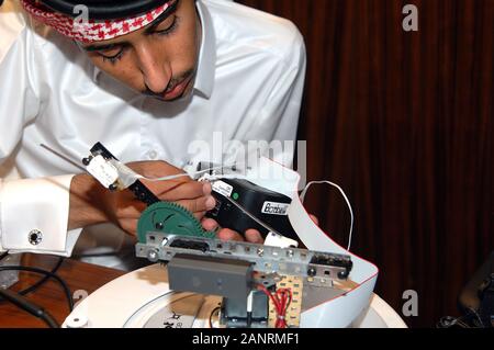 Qatar Foundation University. Qatari Student building a robot for the botball competition. Stock Photo