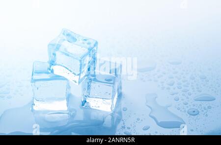 Ice three cubes with drops water clean on blue background Stock Photo