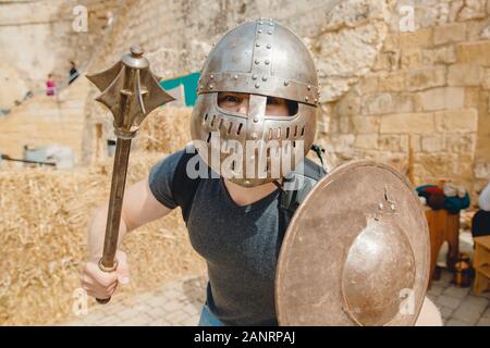 Selfie photo of man wearing knight helmet with armor Viking festival, Malta Stock Photo