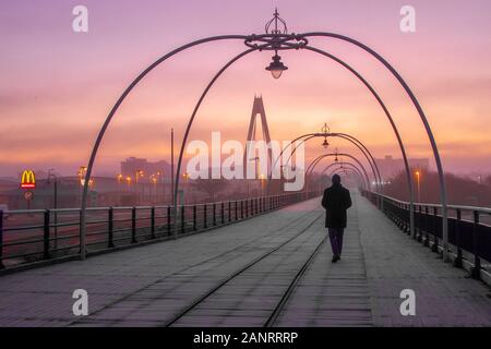 Southport, Merseyside, UK Weather 19th January, 2020   Frosty, freezing, cold misty start for early morning walkers on the resort's pier. The day is expected to be dry with wintry sunshine, and patches of fog  slow to clear. Credit; MediaWorldImages/AlamyLiveNews