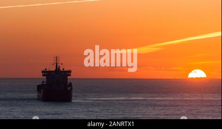 Myrtleville, Cork, Ireland. 19th January, 2019. A winters sunrise silhouettes the superstructure of the oil tanker Stenberg, as she lays at anchor off the coast near Myrtleville, Co. Cork, Ireland. - Credit; David Creedon / Alamy Live News Stock Photo