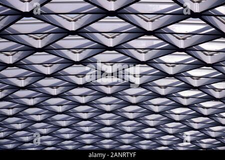 Geometric triangle repeating lines and patterns, skylights architecture design, full frame, fading smaller in the distance Stock Photo