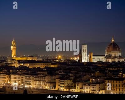 Florence in Tuscany, Italy. View over the city in the late evening January 2020. Taking in the Duomo aka Cathedral and Signoria Tower. Stock Photo