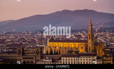 Night landscape view over Florence, Italy, featuring the illuminated Basilica di Santa Croce Holy Cross . Stock Photo