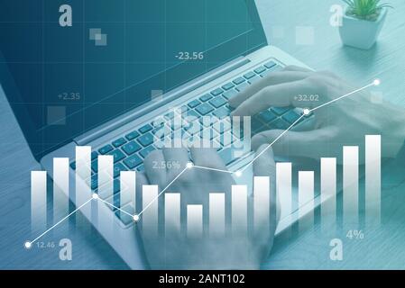 The concept of growth in the value of the market and the business shown in the chart. Detail of working on a laptop computer in the background Stock Photo