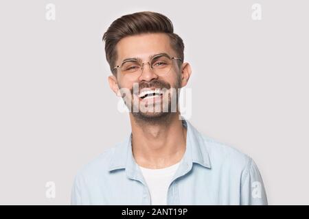 Head shot portrait young laughing happy man in eyeglasses. Stock Photo
