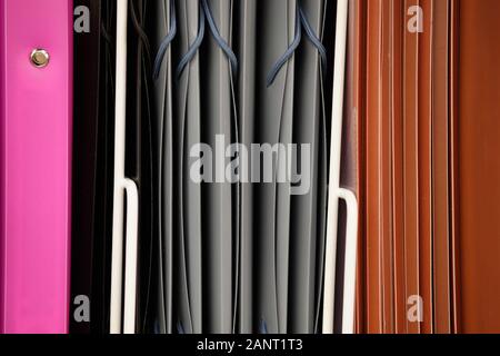 Showcase with stationery - folders for papers. Close up. Stock Photo