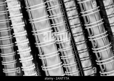 Black-and-white photo with notebooks sewn spiral. Close up. Stock Photo