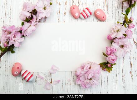 Easter greeting card with cherries blossom and eggs Stock Photo