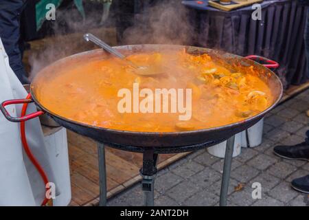 City Riga, Latvia. Street Restaurant food festival. The soup is cooked on open fire.18.01.2020 Stock Photo