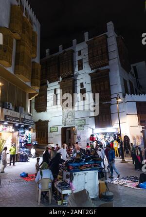 Market in front of a historic house with wooden mashrabiyas in al-Balad quarter, Mecca province, Jeddah, Saudi Arabia Stock Photo