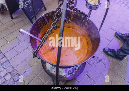 City Riga, Latvia. Street Restaurant food festival. The soup is cooked on open fire.18.01.2020 Stock Photo