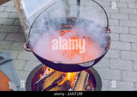 City Riga, Latvia. Street Restaurant food festival. The soup is cooked on open fire.18.01.2020 Stock Photo