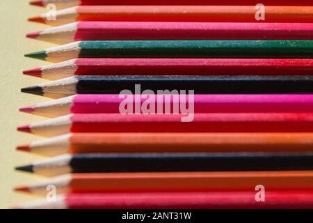 An assortment of sharpened colourful drawing crayons Stock Photo