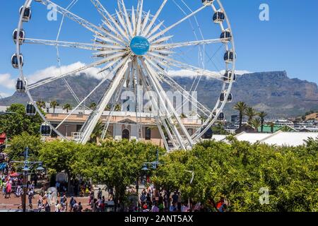 CAPE TOWN, SOUTH AFRICA - JANUARY 01 2020: Giant ferris wheel  in front of Table Mountain at the V & A Waterfront in Cape Town South Africa Stock Photo