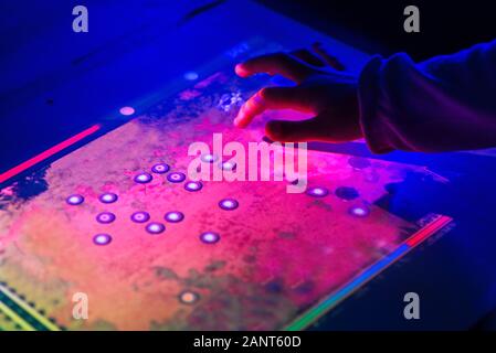 A man clicks on a touch screen screen. Virtual screen tablet. Business, technology, internet and network concept. Stock Photo