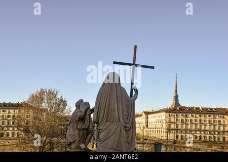 Cityscape from the Church of Gran Madre di Dio with the statue of Religion seen from behind and the top of Mole Antonelliana, Turin, Piedmont, Italy Stock Photo
