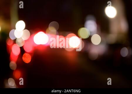 Unfocused night scene with lights from cars and street lights. Stock Photo