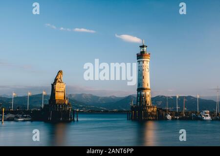 Famous harbor entrance with lighthouse and Bavarian lion of Lindau, Bodensee, Germany Stock Photo