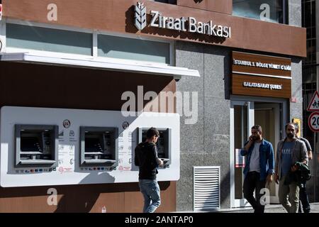 Istanbul, Turkey - October-10.2019: It is one of Turkey's oldest bank. The Ziraat Bank signboard hangs on a brown wall. Wheat plant patterned logo. Stock Photo