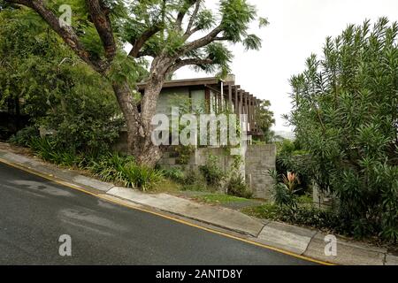 Modern architect designed home in Tenerife on a hillside site with green foliage - Architectural survey in the Brisbane suburbs and their topography Stock Photo
