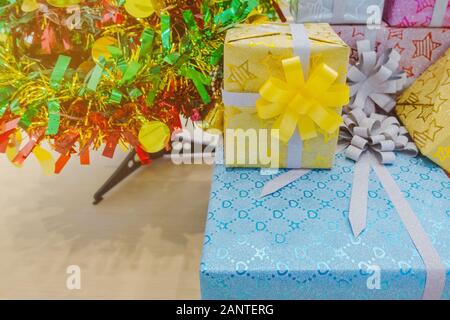 Beautiful various gifts boxes or presents in different size and shape with ribbon on table in the party Stock Photo