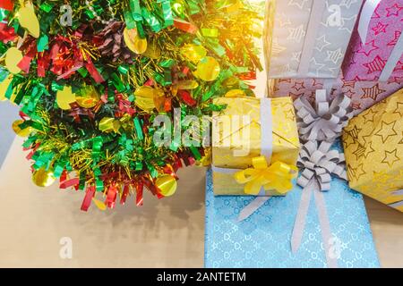 Beautiful various gifts boxes or presents in different size and shape with ribbon on table in the party Stock Photo