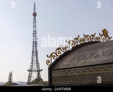 Mini Replica Eiffel Tower and elegant French Colonial architectural details in Da Lat, Vietnam against a blue sky Stock Photo