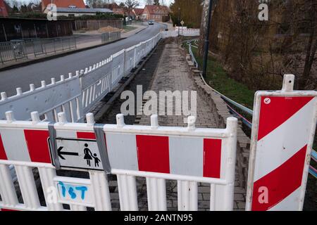 on one street the pavement is torn up and the ground dug up to lay a broadband cable Stock Photo