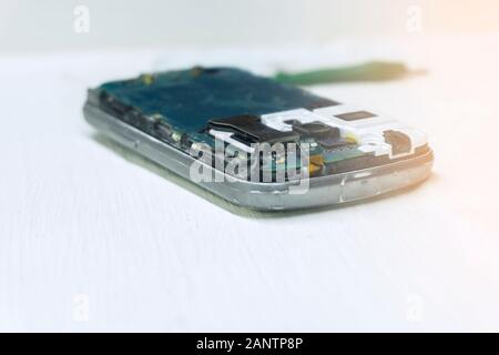 Android Phone. repairs for smartphone By professional technician on desk. Stock Photo
