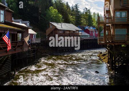 Colorful Houses and walkway built on stilts over the Ketchikan river Stock Photo