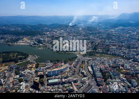 Aerial photo of Da Lat or Dalat, Vietnam city center and surrounds including alpine lake, Cathedral and mini Eiffel tower Stock Photo