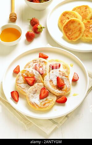 Cottage cheese pancakes with strawberry, close up view Stock Photo