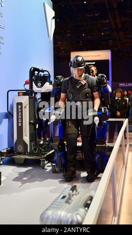 Demonstration of strength of Sarcos Guardian XO full-body powered exoskeleton, soon to be used by Delta Airlines for baggage, at CES, Las Vegas, USA Stock Photo