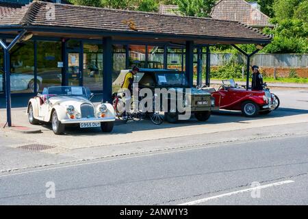 10 June 2015 The forecourt of New Forest Classic Cars Ltd business with classic vintage cars for sale and on display in Beaulieu Village in Hampshire Stock Photo