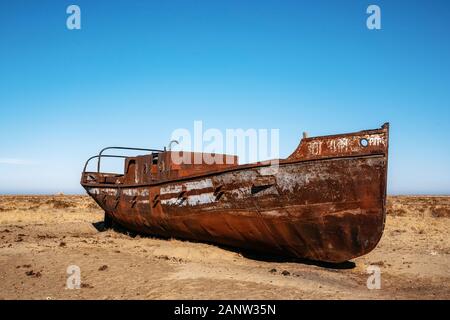 Abandoned boat in desert close to Akbasty in Aral sea or Aral lake, Kazakhstan Stock Photo