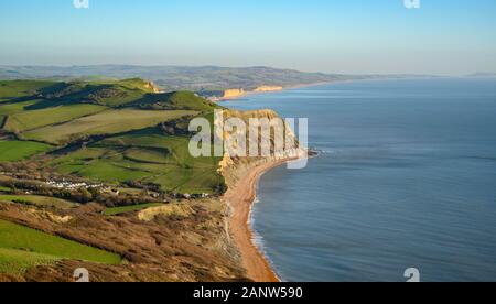 Jurassic Coast, Dorset, UK. 19th January 2020: An afternoon of glorious sunshine and crisp blue skies on the Jurassic Coast. After weeks of heavy rain and high winds, the stunning West Dorset coastline is bathed in winter sunshine on a bright and chilly winters day.  View of the Jurassic coast from Golden Cap looking out over West Bay and Portland. Golden Cap. Credit: Celia McMahon/Alamy Live News. Stock Photo