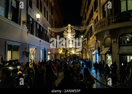 People shopping at Christmas time in Via dei Condotti in downtown Rome Italy Stock Photo