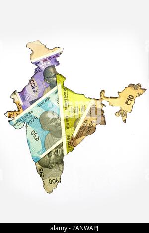 Head-on shot of Indian Map of white color with indian bank notes of 10,20,50,100 Rupees banknote on it, black background, Paper cut-out of indian map Stock Photo