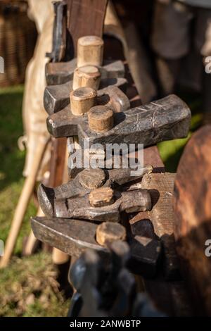 Forge in the open air during the living history festival. Hammers of different sizes. Vintage blacksmith tools. Stock Photo