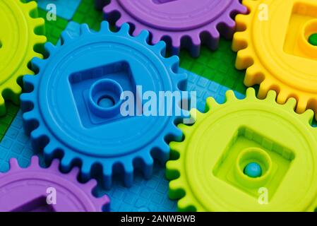 Gear wheels made of plastic. Multi-colored links of mechanisms. Designer plastic blocks Stock Photo