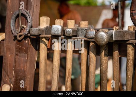 Hammers of different sizes. Vintage blacksmith tools. Forge in the open air during the living history festival Stock Photo